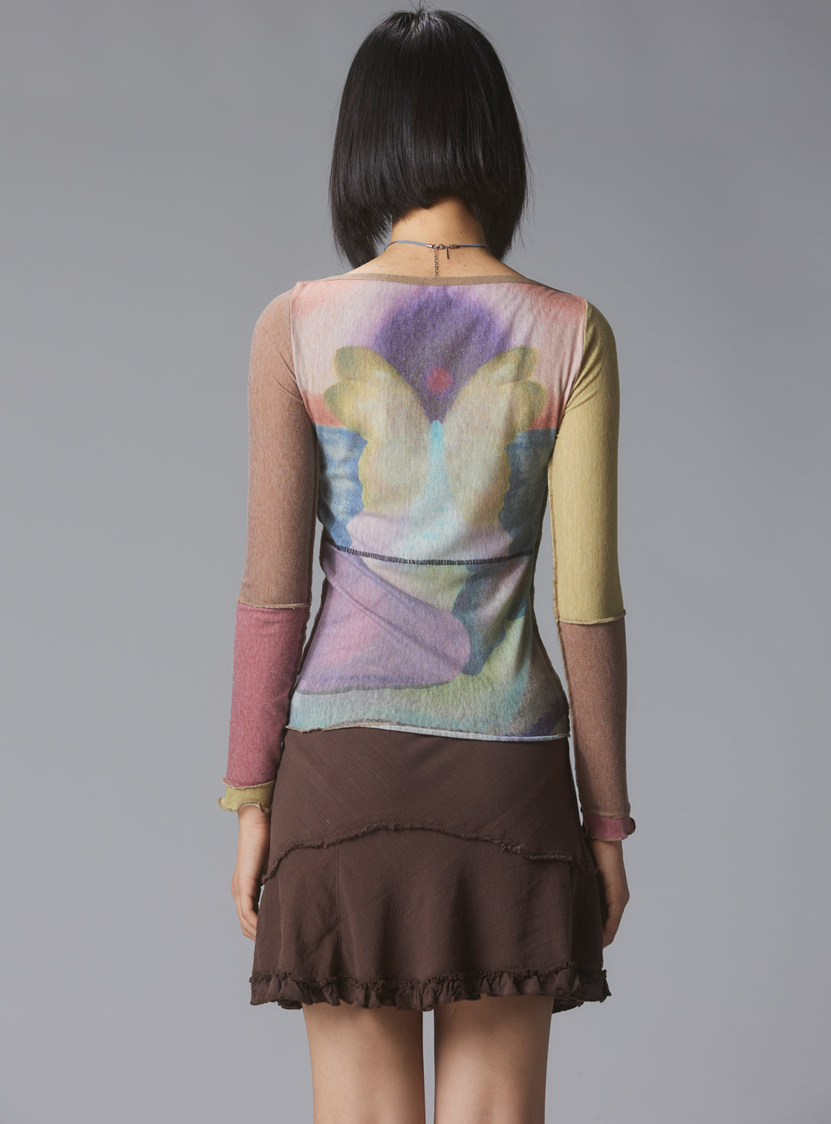 Skye Top Y2K allover-print mesh top with custom artwork - UNIF Clothing