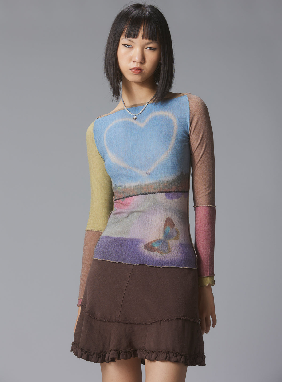 Skye Top Y2K allover-print mesh top with custom artwork - UNIF Clothing